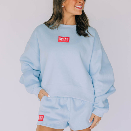 The Becca Boxy Crewneck Hotty Toddy Woven Label | Light Blue