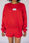The Becca Boxy Crewneck Hotty Toddy Woven Label | Bright Red