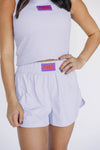 The Liz Nylon Shorts Fight Tigers Woven Label | Lavender