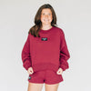 The Becca Boxy Crewneck Spurs Up Woven Label | Deep Red
