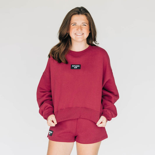 The Becca Boxy Crewneck Spurs Up Woven Label | Deep Red