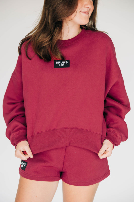 The Becca Boxy Crewneck Spurs Up Woven Label | Deep Red