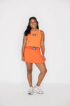 The Alli Tennis Skort War Eagle Woven Label | Orange