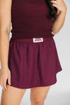 The Alli Tennis Skort Hail State Woven Label | Deep Maroon
