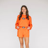 The Ava Airy Shorts War Eagle Woven Label | Orange