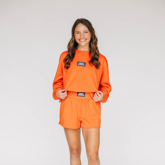 The Ava Airy Shorts War Eagle Woven Label | Orange