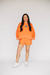 The Becca Shorts War Eagle Woven Label | Orange