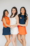 The Anna Active Skort War Eagle Woven Label | Orange