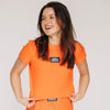 The Raegan Ribbed Baby Tee War Eagle Woven Label | Orange