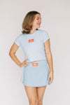 The Raegan Ribbed Baby Tee War Eagle Woven Label | Light Blue