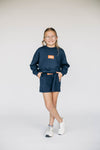 The Ava Airy Crewneck War Eagle Woven Label | Youth Navy