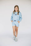 The Ava Airy Shorts War Eagle Woven Label | Youth Light Blue