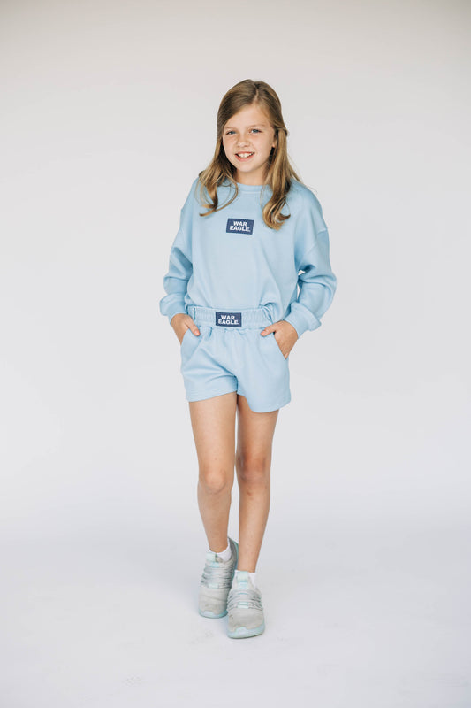 The Ava Airy Shorts War Eagle Woven Label | Youth Light Blue