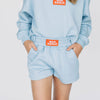 The Ava Airy Shorts War Eagle Woven Label | Youth Light Blue