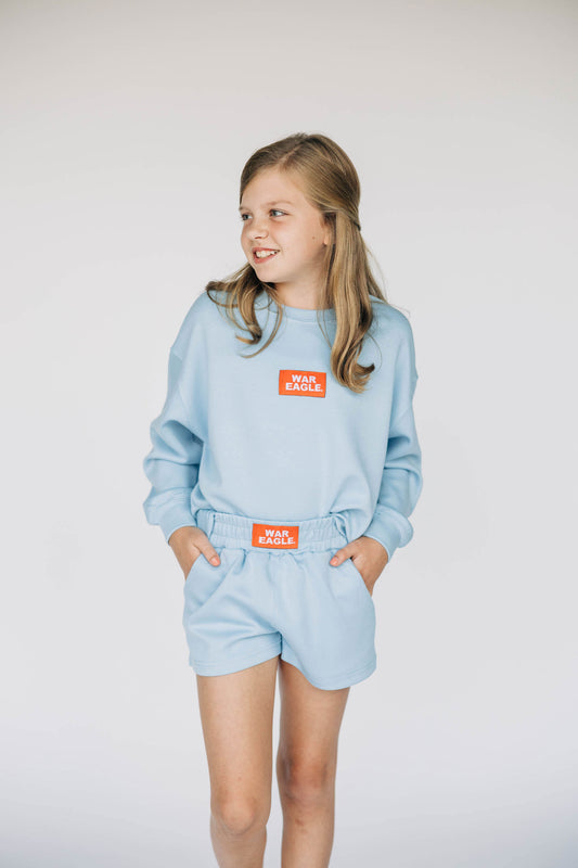 The Ava Airy Shorts War Eagle Woven Label | Youth Light Blue
