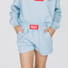 The Ava Airy Shorts Hotty Toddy Woven Label | Youth Light Blue
