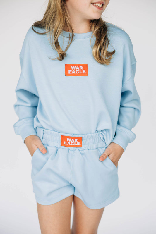 The Ava Airy Crewneck War Eagle Woven Label | Youth Light Blue