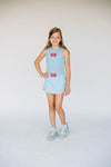 The Alli Tennis Skort Hotty Toddy Woven Label | Youth Light Blue