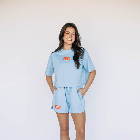 The Kristen Airy Tee War Eagle Woven Label | Light Blue