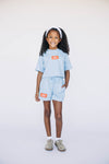 The Kristen Airy Tee War Eagle Woven Label | Youth Light Blue