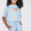 The Kristen Airy Tee War Eagle Woven Label | Youth Light Blue