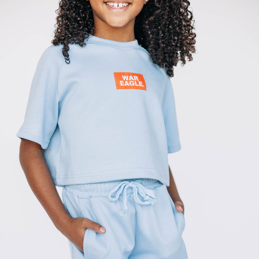 The Kristen Airy Tee War Eagle Woven Label | Youth Light Blue