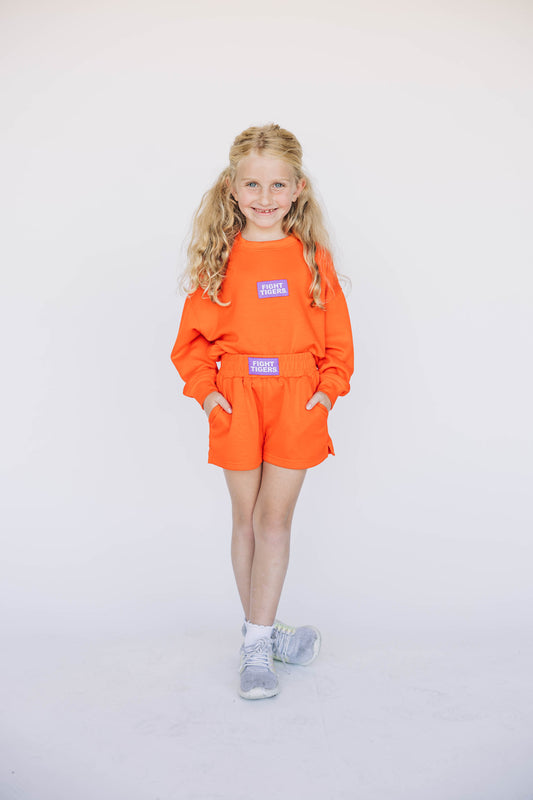 The Ava Airy Shorts Fight Tigers Woven Label | Youth Orange