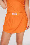 The Alli Tennis Skort Hook 'Em Horns Woven Label | Burnt Orange