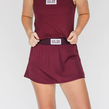 The Alli Tennis Skort Gig 'Em Aggies Woven Label | Deep Maroon