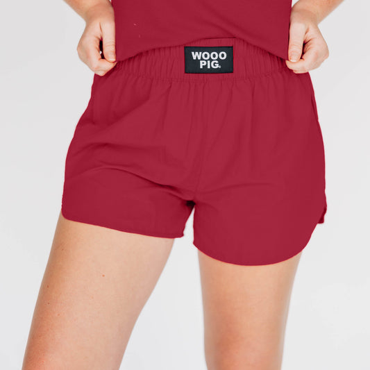 The Liz Nylon Shorts Wooo Pig Woven Label | Crimson