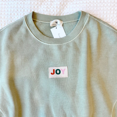 The Joy Woven Label | Sage Crewneck