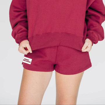 The Becca Shorts Troy Trojans Woven Label | Deep Red