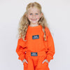 The Ava Airy Crewneck War Eagle Woven Label | Youth Orange